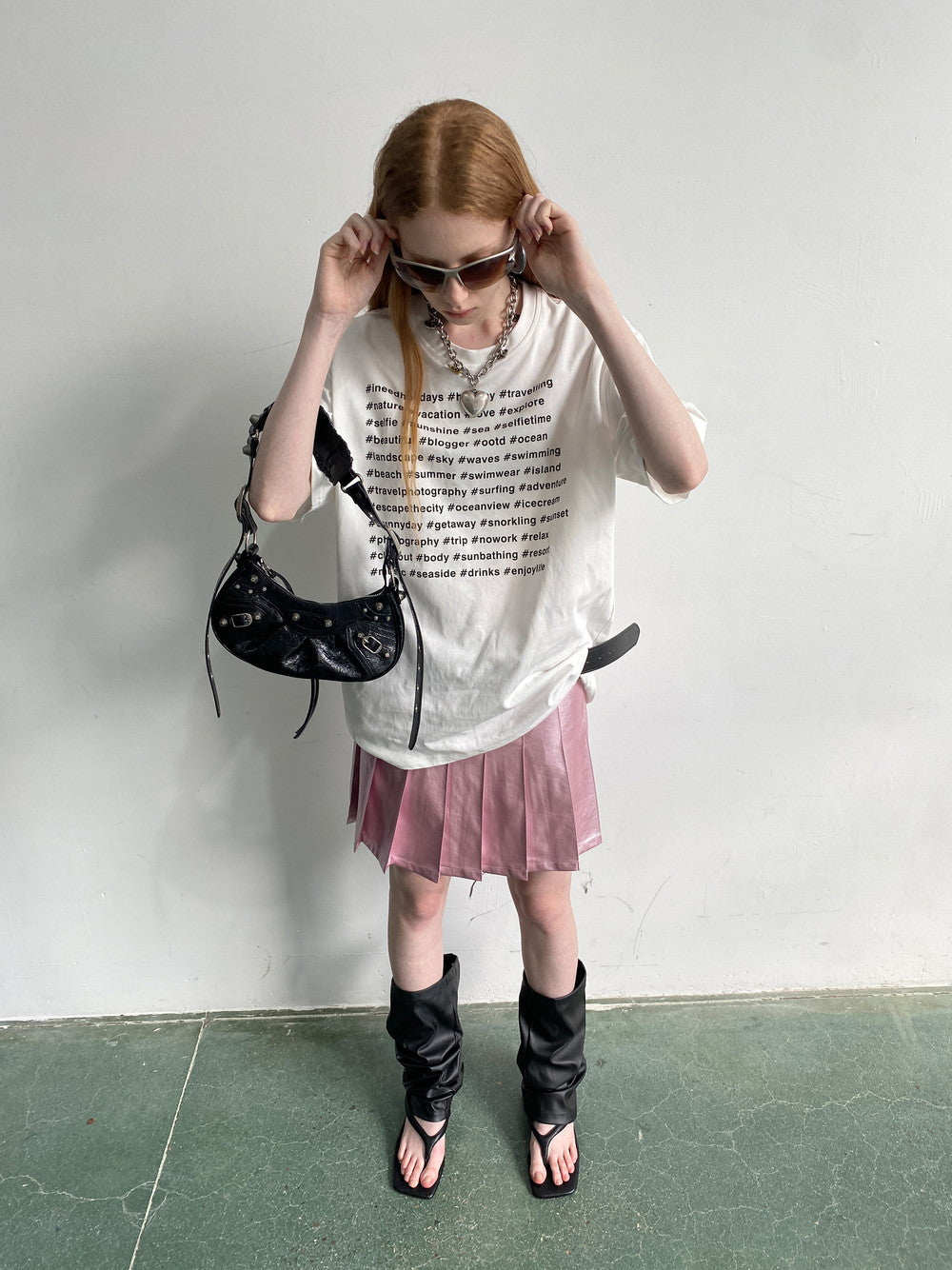 Pleatas glänzende Leder-Minirocke