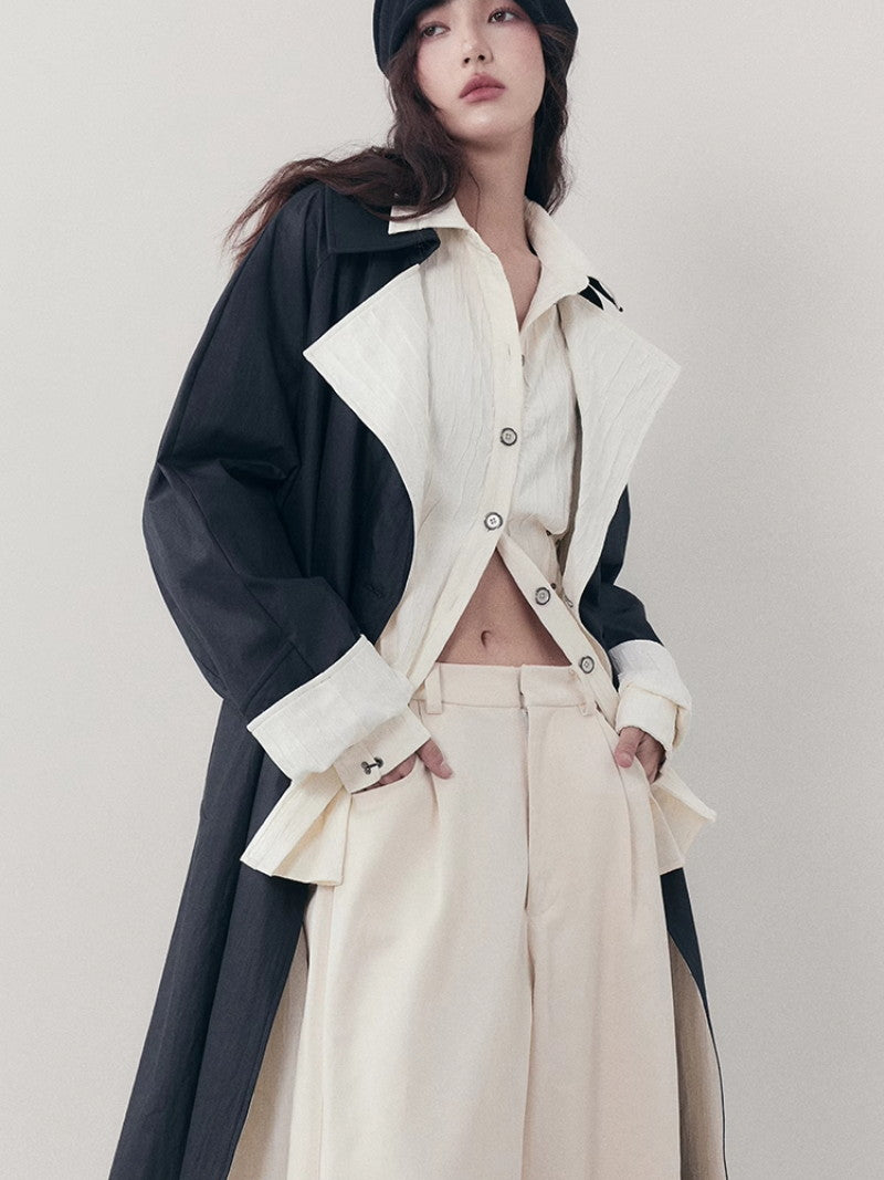 바이 컬러 니치 모노톤은 긴 코트를 주름지게했다