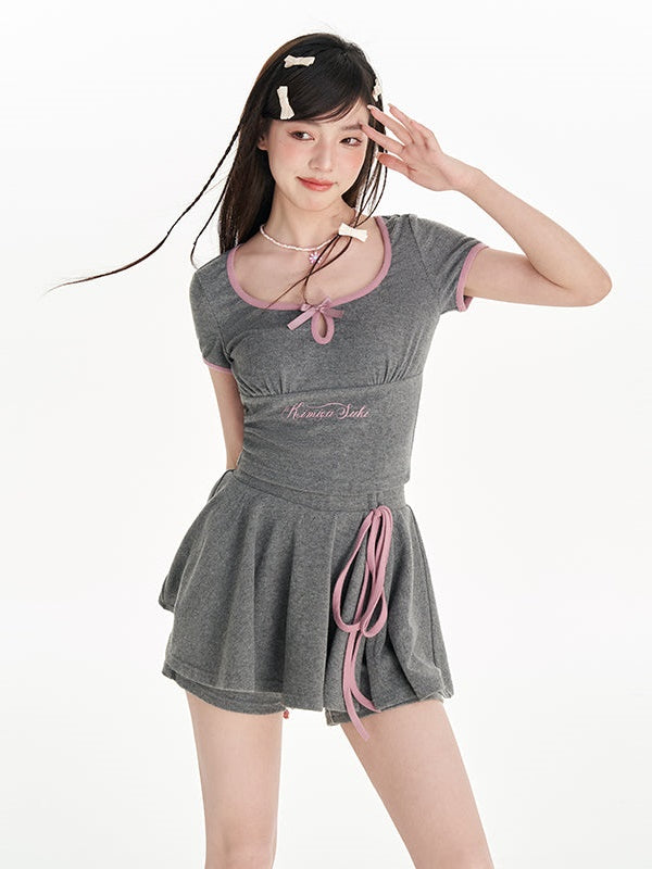 U-Neck-Druckbow-Top & Schlitzrockhose