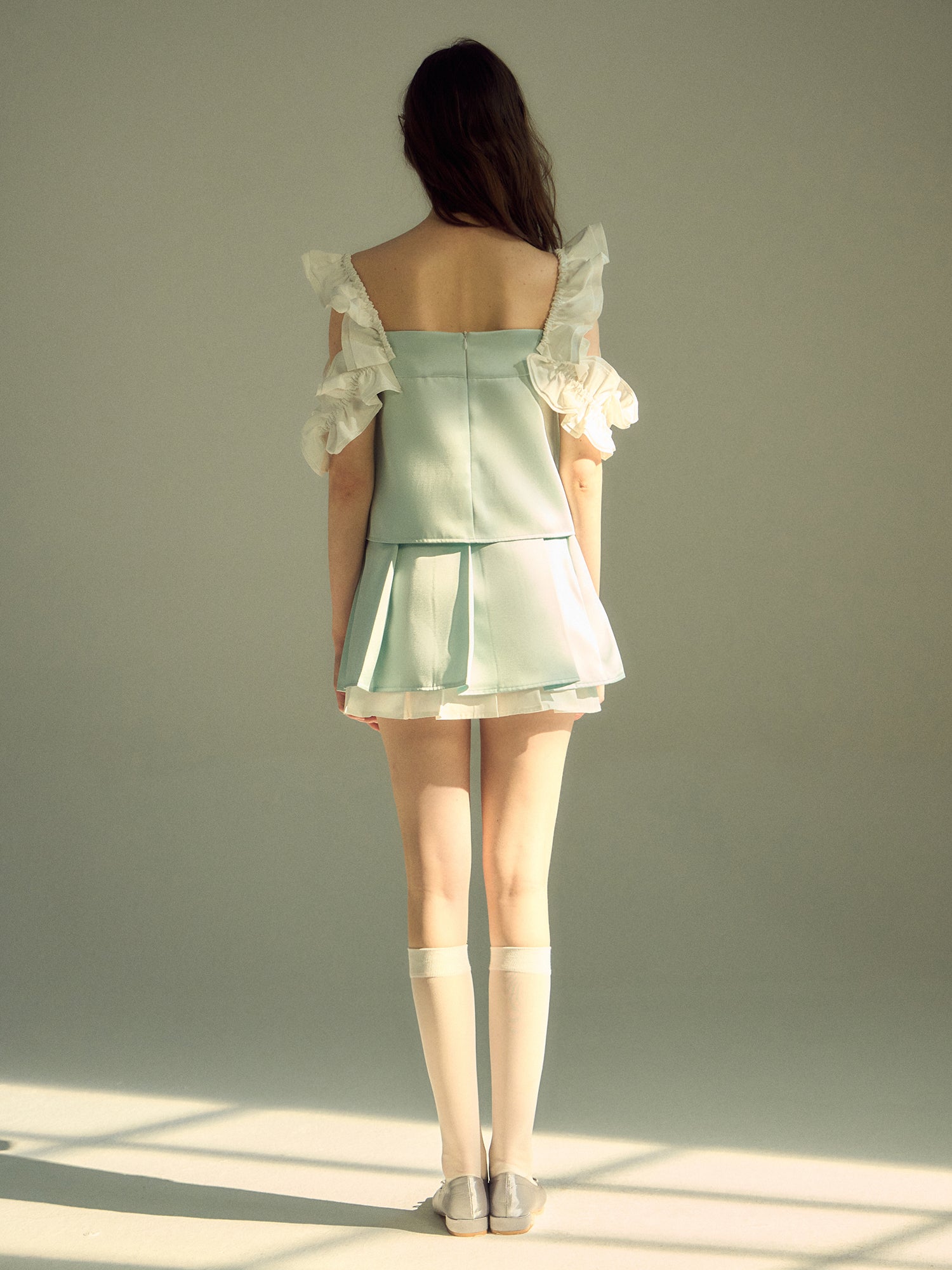 Dreidimensionale Spitzenhülsenweste & Faltenrock