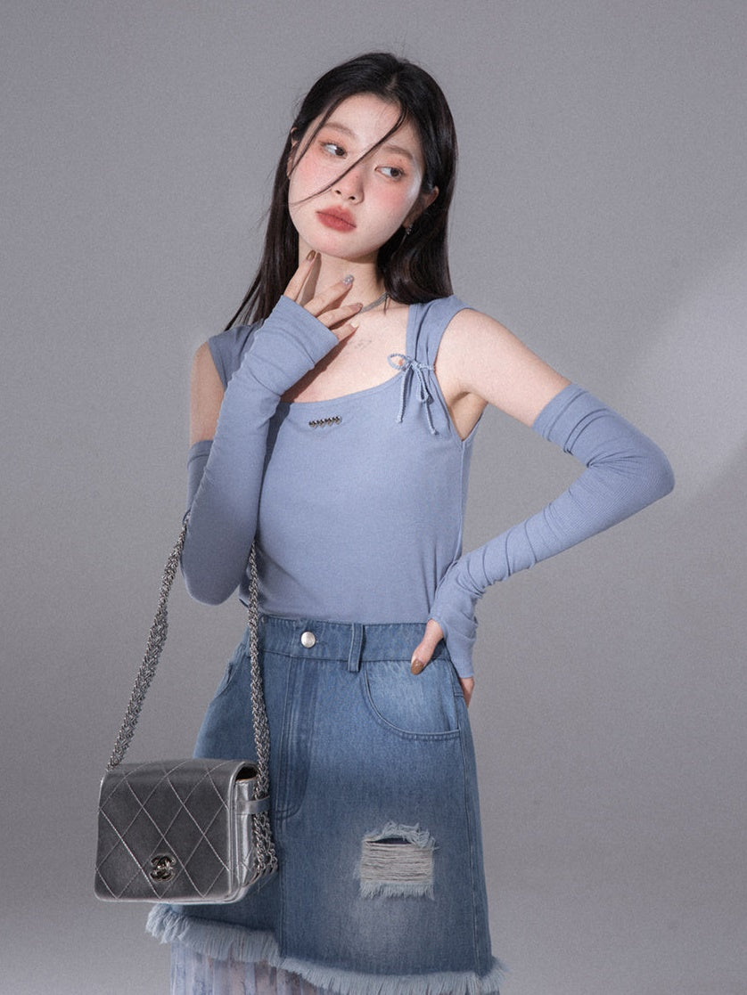 En denim épissant la jupe de fil tachée