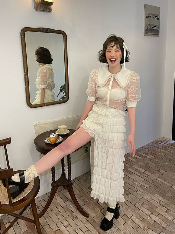 Blouse transparente à manches bouffantes à broderie