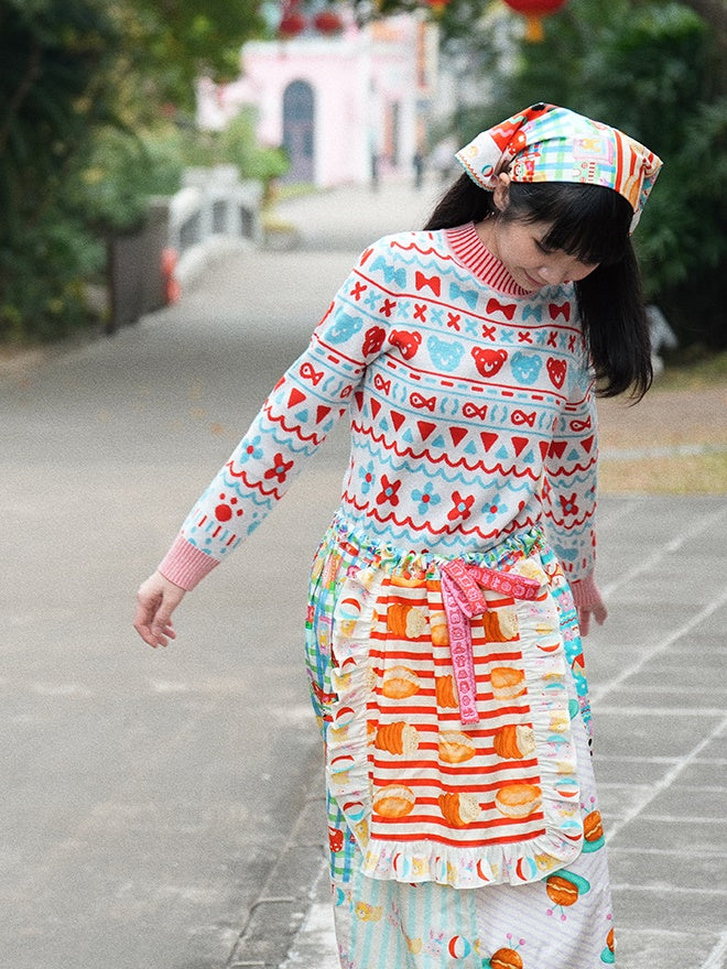 머리를 날씬한 니트 스웨터