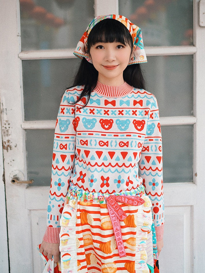 머리를 날씬한 니트 스웨터