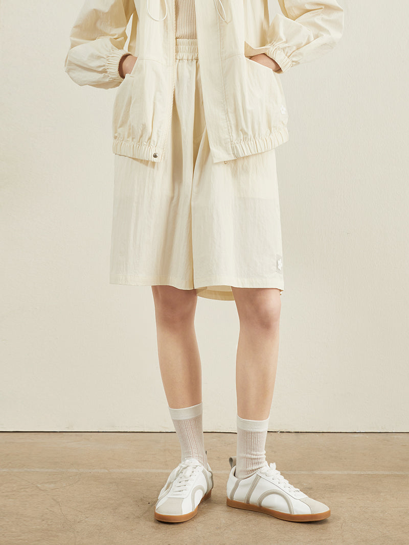 Draw String -Designjacke und kurze Hosen