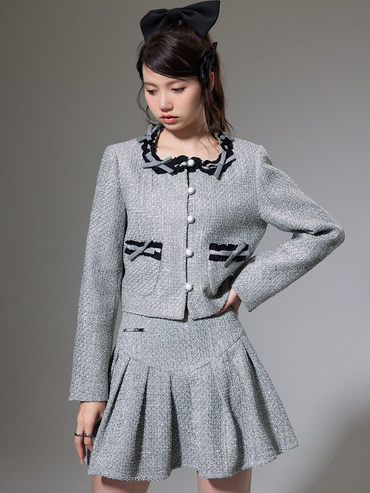 Kleine Duft -Bow -Strickjacke und Faltenrock