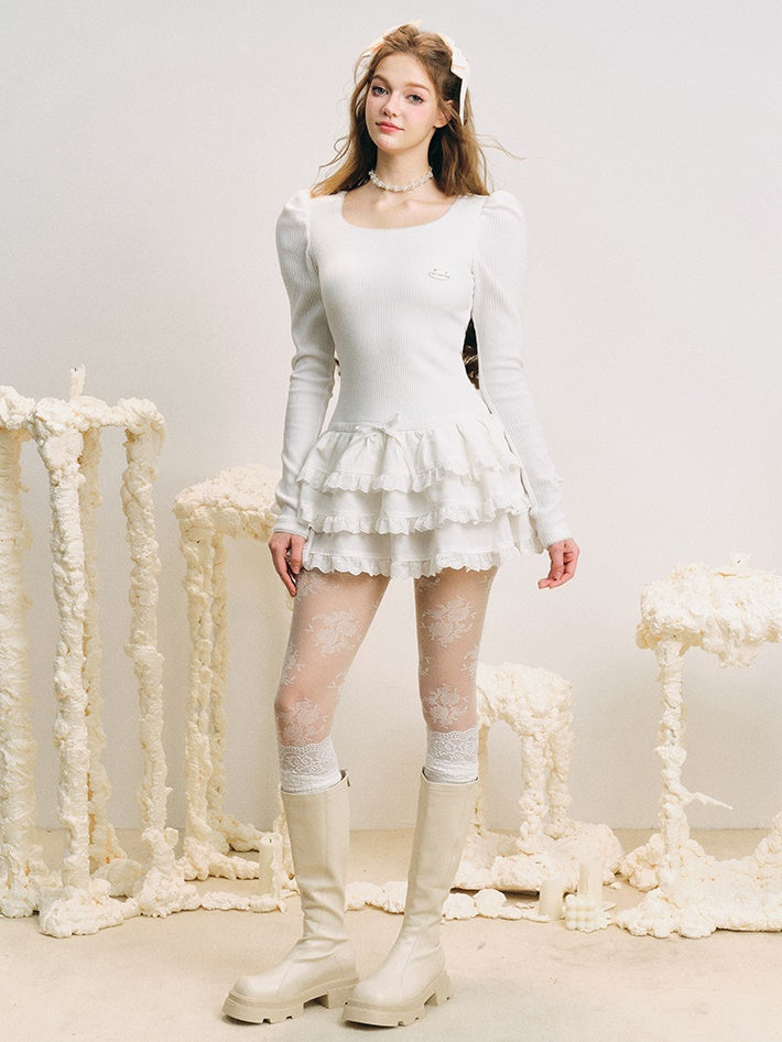 Robe de gâteau bouffy à manches bouffantes à coude en u-cou