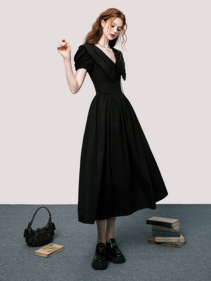 Robe noire à manches bouffantes en V-Neck