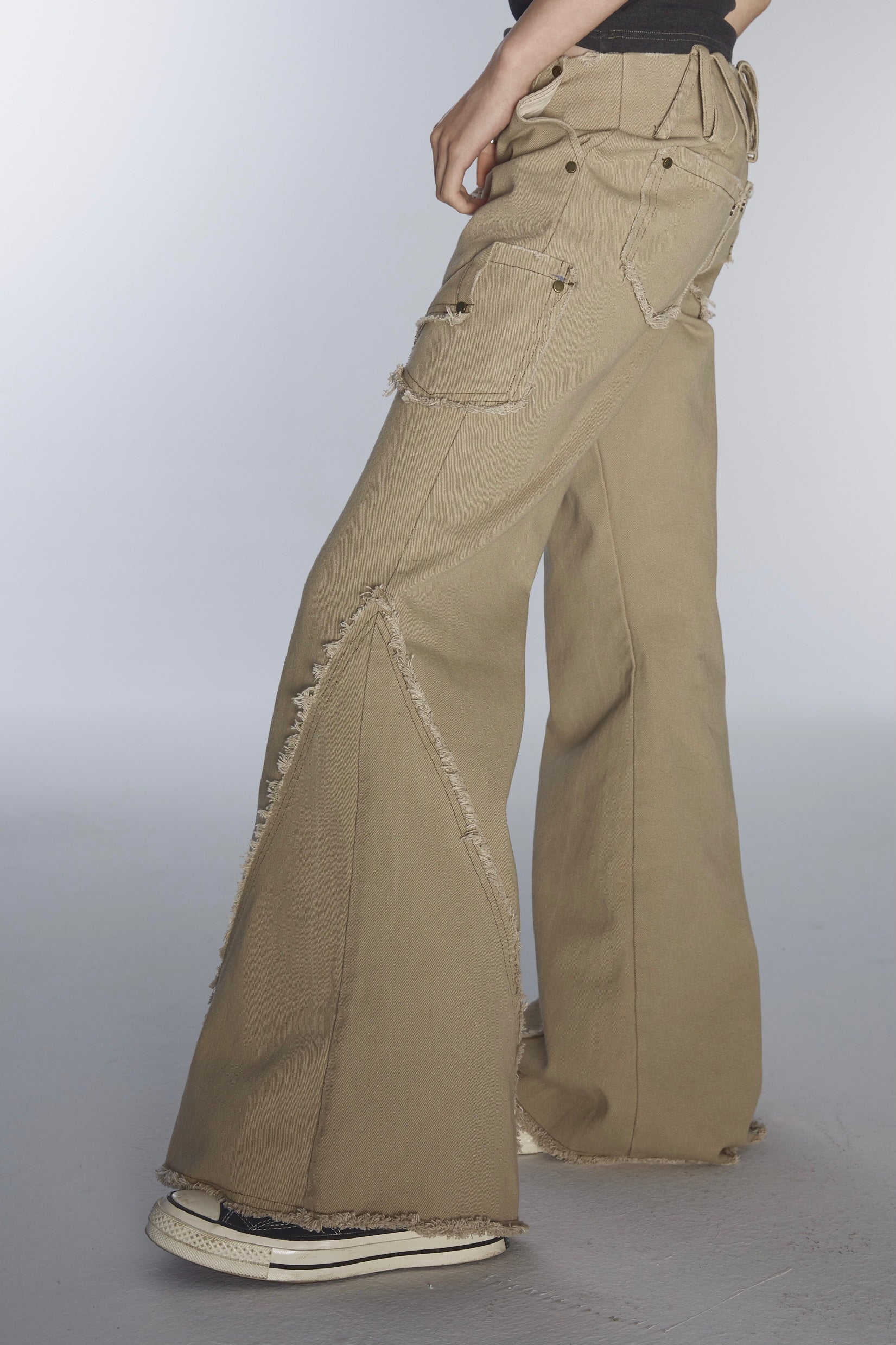 ULTRA-LOW WAIST RAW EDGE RIVET DENIM FLARED PANTS